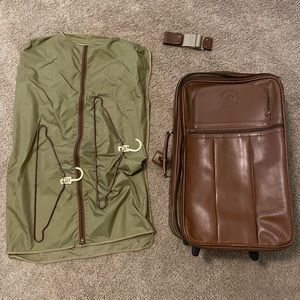 Ghurka leather rolling suitcase